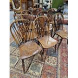 EIGHT ANTIQUE WINDSOR WHEEL BACKED CHAIRS WITH OAK SADDLES SEATS