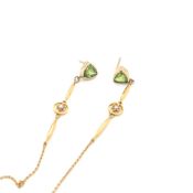 A PAIR OF PERIDOT AND SEED PEARL DROP EARRINGS. THE PERIDOT STUD EARRINGS SET IN UNHALLMARKED RUB