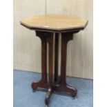 AN ARTS AND CRAFTS WALNUT OCTAGONAL TABLE, THE FOUR LEGS SUPPORTING THE CENTRE OF THE UNDERSIDE