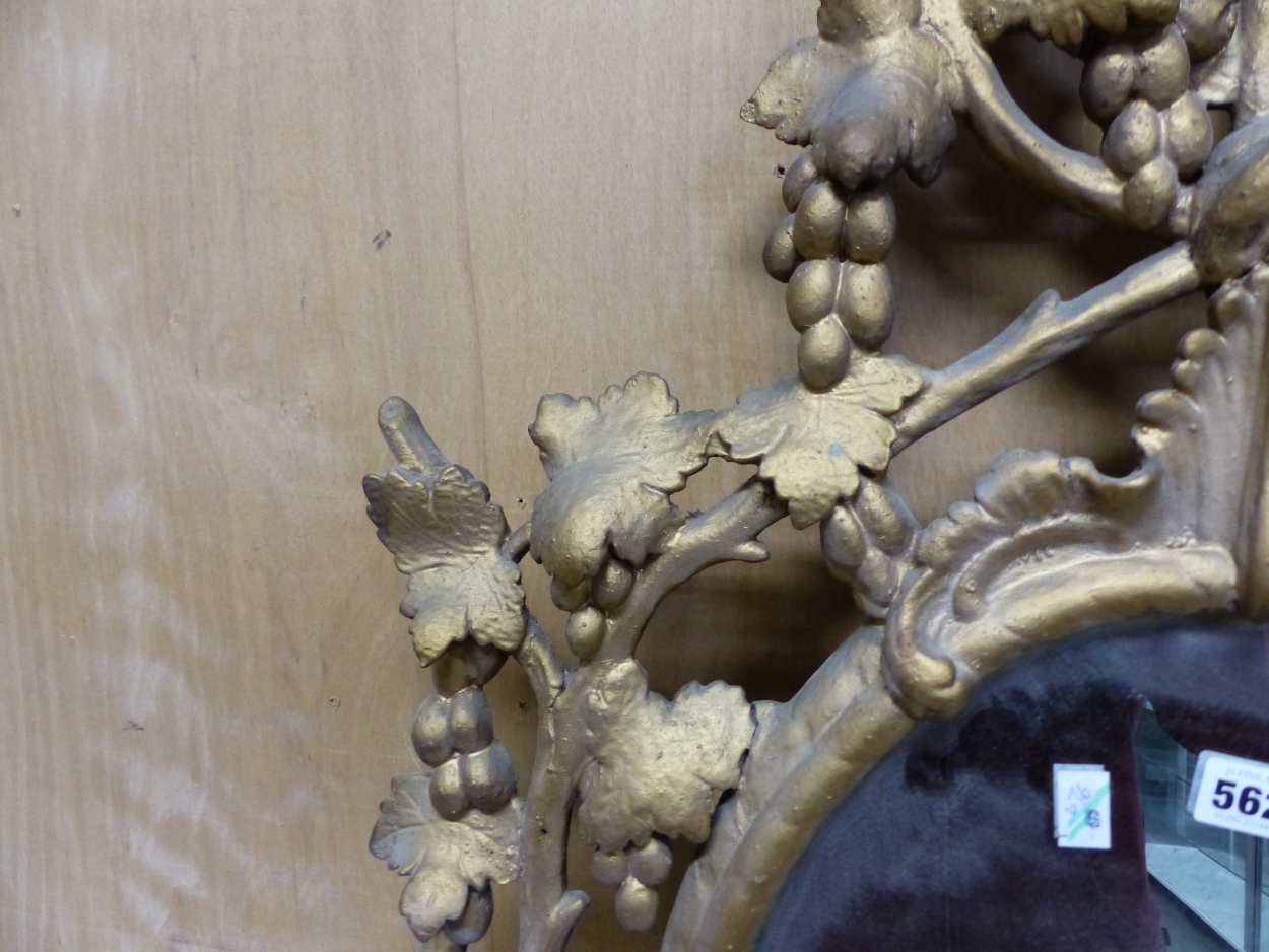 AN OVAL MIRROR IN A LATE 18th C. GILT FRAME PIERCED AND CARVED WITH GRAPE VINES. 95 x 64cms. - Image 3 of 12