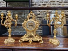 A LEMERLE CHARPENTIER ORMOLU CLOCK GARNITURE, THE CLOCK MOVEMENT STRIKING ON A BELL, THE FACE WITH