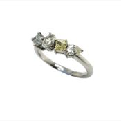 A PLATINUM HALLMARKED YELLOW AND WHITE DIAMOND FOUR STONE RING, CONSISTING OF AN EMERALD CUT, OVAL