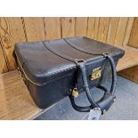 A SALVATORE FERRAGAMO BLACK LUGGAGE CASE TOGETHER WITH A BROWN LEATHER TRAVEL BAG