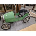 A GREEN PAINTED PEDAL CAR BEARING THE NUMBER PLATE 1939