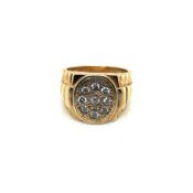 A 9ct HALLMARKED GOLD DIAMOND SET SIGNET RING WITH PRESIDENT STYLE SHOULDERS. APPROX ESTIMATED