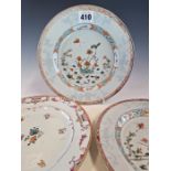 A PAIR OF CHINESE FAMILLE VERTE PLATES PAINTED WITH DUCKS AND FISH SWIMMING AMONGST LOTUS. Dia. 23.