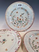 A PAIR OF CHINESE FAMILLE VERTE PLATES PAINTED WITH DUCKS AND FISH SWIMMING AMONGST LOTUS. Dia. 23.