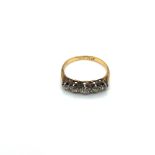 AN ANTIQUE FIVE STONE GRADUATED OLD CUT DIAMOND RING. UNHALLMARKED, STAMPED 18 & PLAT, ASSESSED AS