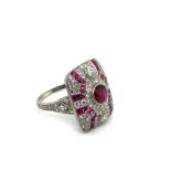 AN ART DECO STYLE RUBY AND DIAMOND PANEL RING. UNHALLMAKRED, ASSESSED AS PLATINUM. ESTIMATED