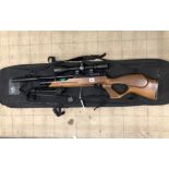 A WEIHRAUCH HW100 SPORT .177 PRE CHARGED AIR RIFLE. SERIAL NUMBER 1979854 COMPLETE WITH SCOPE AND