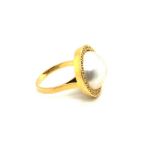 AN 18ct HALLMARKED GOLD MABE PEARL AND DIAMOND RING. FINGER SIZE L. WEIGHT 6.59grms.