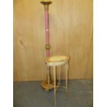 A PINK AND GILT STANDARD LAMP COLUMN. H 150cms. TOGETHER WITH A SIDE TABLE, THE OVAL TOP PAINTED
