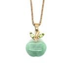 A 9ct HALLMARKED GOLD JADE AND GEMSET APPLE PENDANT SUSPENDED ON A 9ct GOLD SNAKE CHAIN. PENDANT