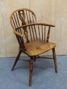AN 19th CENTURY OAK AND ELM LOW BACKED WINDSOR CHAIR WITH CRINOLINE STRETCHER