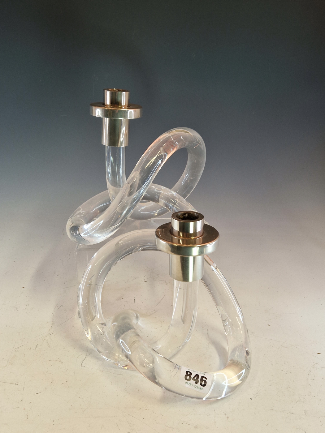 A PAIR OF VINTAGE ART DECO STYLE CANDLESTICKS WITH CHROME NOZZLES AND DRIP PANS ON KNOTTED TUBULAR