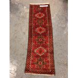 A PERSIAN KARADJA RUG. 194 x 64cms