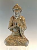 A BRONZE FIGURE OF THE BUDDHA SEATED CROSS LEGGED HIS HANDS CLASPED BEFORE HIS CHEST, HIS HEAD