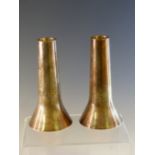 A PAIR OF GEORG JENSEN STERLING SILVER 1140 CANDLESTICKS FLARING FROM THE NOZZLES TO THE FOOT