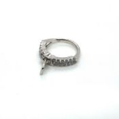 AN 18ct HALLMARKED WHITE GOLD AND DIAMOND ZIP RING. APPROX STATED ESTIMATED DIAMOND WEIGHT 1.