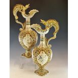 A PAIR OF FISCHER OF BUDAPEST DRAGON HANDLED RETICULATED POTTERY EWERS, THE BALUSTER BODIES