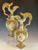 A PAIR OF FISCHER OF BUDAPEST DRAGON HANDLED RETICULATED POTTERY EWERS, THE BALUSTER BODIES