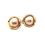 A PAIR OF WHITE MABE PEARL AND DIAMOND ROUND STUD EARRINGS FITTED WITH A LEVER BACK SAFETY.