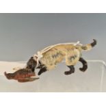 AN AUSTRIAN COLD PAINTED BRONZE SPANIEL RETRIEVING A COCK PHEASANT. W 10cms. TOGETHER WITH ANOTHER
