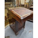AN EARLY 19th C. ROSEWOOD DAVENPORT, THE BRASS GALLERIED TOP ABOVE A LEATHER INSET FALL, FOUR