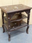 AN ISLAMIC MAHOGANY THREE TIER TABLE, EACH BLIND FRET CARVED WITH FOLIAGE BANDS ABOUT MOTHER OF