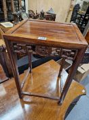 A CHINESE HARDWOOD OCCASIONAL TABLE, THE APRON ON THREE SIDES CENTRED BY A CASH MEDALLION. W 33 x