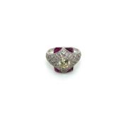AN OLD CUT DIAMOND AND FANCY CUT RUBY ART DECO STYLE OPEN WORK RING. UNHALLMARKED, STAMPED PLAT,