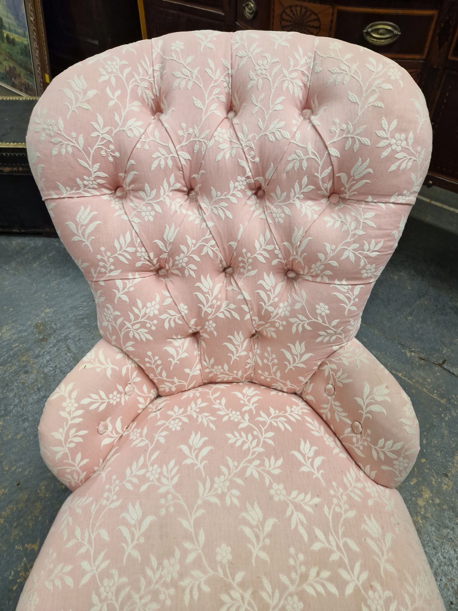 A 19th C. NURSING CHAIR BUTTON UPHOLSTERED IN PINK GROUND MATERIAL WITH WHITE FLORAL PATTERNING, THE - Image 2 of 4