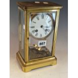 A BEVEL GLAZED BRASS CASES CLOCK BY RICHARD ET CIE, THE MERCURY COMPENSATED PENDULUM MOVEMENT