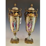 A PAIR OF LATE 19th C. FRENCH ORMOLU MOUNTED TWO HANDLED VASES AND COVERS PAINTED ON ONE SIDE WITH