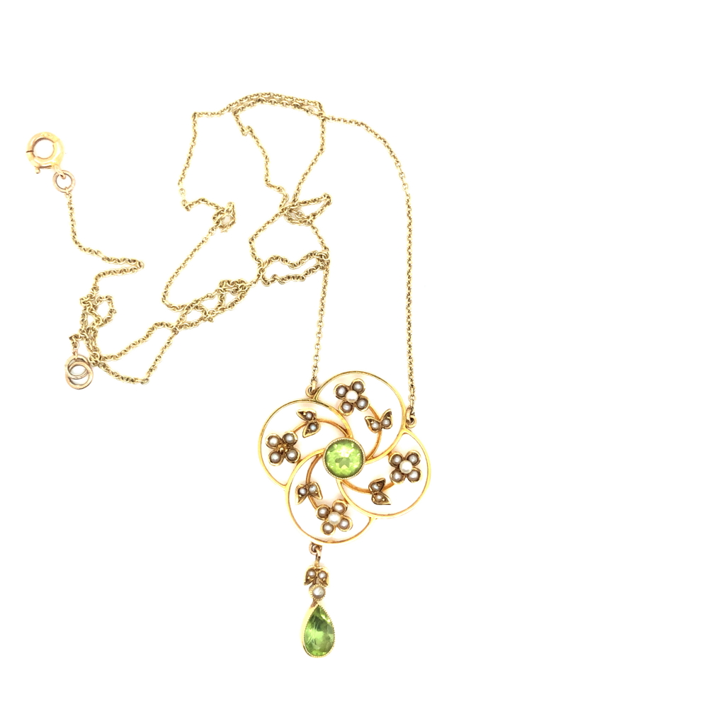 AN EDWARDIAN PERIDOT AND SEED PEARL FOLIATE WREATH STYLE PENDANT, WITH A SUSPENDED PERIDOT AND PEARL