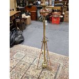 A VICTORIAN AND LATER BRASS STANDARD LAMP, THE COPPER OIL RECEIVER NOW FITTED FOR ELECTRICITY, THE