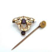 AN ART NOUVEAU STYLE GEM SET BROOCH AND A DIAMOND SET STICK PIN. BOTH STAMPED 15ct AND ASSESSED AS