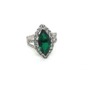 AN 18ct HALLMARKED WHITE GOLD EMERALD AND DIAMOND MARQUISE RING. THE EMERALD IN A RAISED SIX CLAW