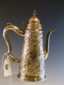 A LATER FLORAL EMBOSSED QUEEN ANNE SILVER COFFEE POT CIRCA 1705, WITH REPLACEMENT HANDLE, 938.5Gms.