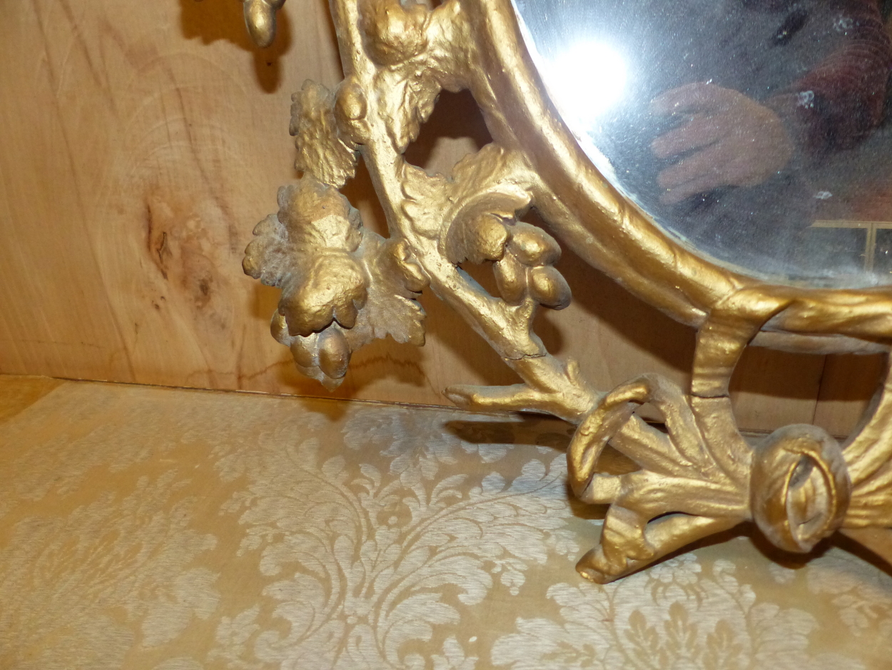 AN OVAL MIRROR IN A LATE 18th C. GILT FRAME PIERCED AND CARVED WITH GRAPE VINES. 95 x 64cms. - Image 5 of 12