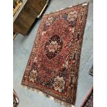 AN ANTIQUE PERSIAN SHIRAZ RUG. 260 x 172cms