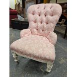 A 19th C. NURSING CHAIR BUTTON UPHOLSTERED IN PINK GROUND MATERIAL WITH WHITE FLORAL PATTERNING, THE