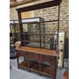 A 19th C. OAK DRESSER, THE OPEN THREE SHELF BACK OVER A BASE WITH THREE DRAWERS, ARCHED APRON AND