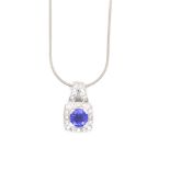 A TANZANITE AND DIAMOND PENDANT SUSPENDED ON A 14ct HALLMARKED WHITE GOLD SNAKE CHAIN. THE PENDANT