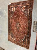 AN ANTIQUE PERSIAN QASHGAI RUG. 240 x 144cms