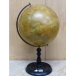 AN EARLY 20th C. GEOGRAPHIA 12 INCH TERRESTIAL GLOBE ON AN EBONISED STAND
