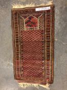 A BELOUCH PRAYER RUG. 150 x 84cms TOGETHER WITH A PERSIAN TRIBAL RUG. 158 x 120cms (2)