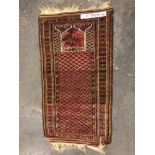 A BELOUCH PRAYER RUG. 150 x 84cms TOGETHER WITH A PERSIAN TRIBAL RUG. 158 x 120cms (2)