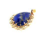 A VINTAGE HANDCRAFTED LAPIS PEAR SHAPED PENDANT WITH SCROLL DESIGN MOUNT. UNHALLMARKED, INDISTINCT