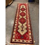 A PERSIAN SERAB RUNNER. 330 x 98cms